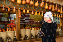Bukhara, Uzbekistan, Tourist On The Main Bazaar Is Photographing The Stall With Spices In Bukhara Of Architectural Pearl On The Silk Route 