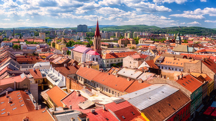 Panoramic view of Kosice Old city from St. Elisabeth Cathedral, scenic daytime cityscape with streets, red tiled roofs of medieval buildings and blue cloudy sky, urban skyline, Slovakia (Slovensko)