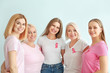 © Pixel-Shot - Beautiful women of different ages with pink ribbons on light background. Breast cancer concept