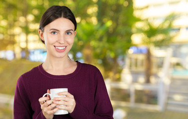 Canvas Print - Young and beautiful woman portrait  drinking coffee