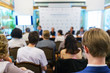 © Evgenii Starkov - Conference participants, events, presentations, listen to the speaker sitting in chairs.
