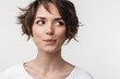 Beautiful young pretty thinking thoughtful woman posing isolated over white wall background.