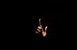 © sutadimages - Empty hand pointing finger on black dark background