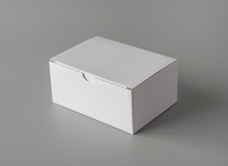 White package cardboard box for products on grey background for print design and mock up