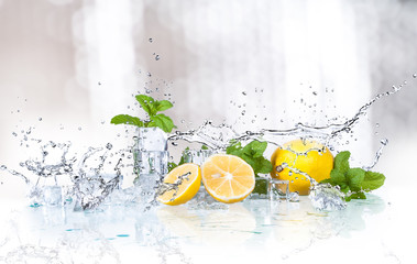 Wall Mural - ice cubes, mint leaves with lemons isolated on a white background