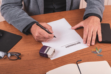 male hands, filling in questionnaires, close up