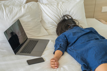 Exhausted woman sleeping on bed in the business trip