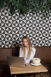 © Alvaro Hernandez/ADDICTIVE STOCK - Female freelancer browsing modern laptop while sitting at table with bowl of healthy salad in cozy restaurant