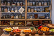 © Carles Alonso/ADDICTIVE STOCK - Ancient village cottage cellar with bottles of spices, bowls of healthy natural vegetables and juicy ripe fruits