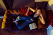 © Manuel Ruiz Alba/ADDICTIVE STOCK - Young sexy woman sitting on sofa with apple