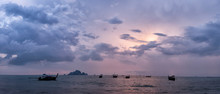 Thailand, Krabi, Tonsai Beach, Long-tail Boats Floating On Water At Sunset
