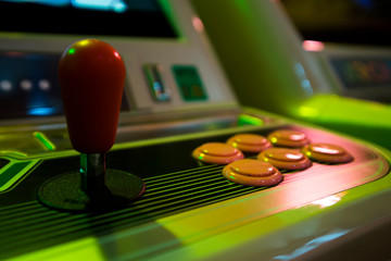 Wall Mural - Detail on a red joystick of an old vintage arcade game