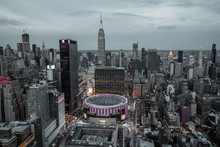 View From Top On Madison Square Garden And Empire State Building. Night Lights