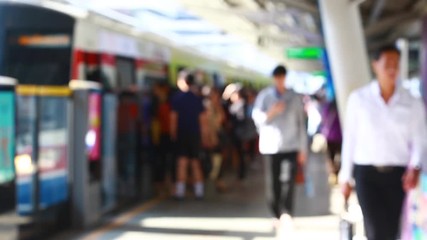 Wall Mural - Blurry of people walking to getting on and getting out electric skytrain with automatic gateway, railroad transportation for passenger in city, traveler and urban lifestyle. BTS.