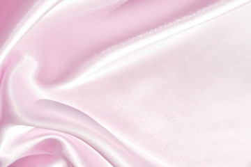 Charming smooth satin and silk pink fabric for backgrounds. Elegant abstract upholstery use for holidays 