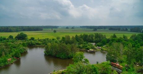 Naklejka na meble Aerial photograph of a lake area with small pleasure boats and a large agricultural pasture in the background in the flat landscape of northern Germany, high