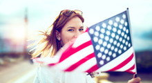 Young Patriot Modern Woman Holding USA Flag Depth Of Field