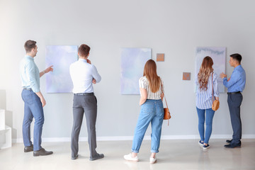 Wall Mural - People at exhibition in modern art gallery