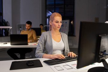 Wall Mural - business, deadline and technology concept - designer or user interface developer with computer worki
