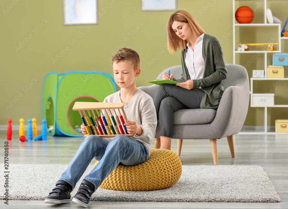 Little boy with autistic disorder at child psychologist's office