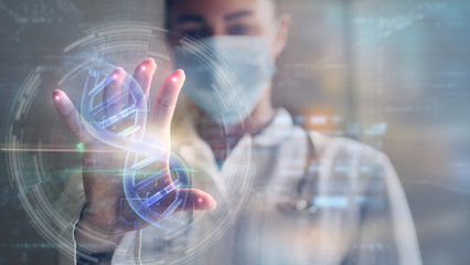 Portrait of a woman doctor is using a futuristic latest innovative technology for viewing samples of DNA with augmented reality holograms in a laboratory.