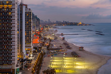 Elevated View Of The Beaches And Hotels At Dusk, Jaffa Visible In The Background, Tel Aviv, Israel