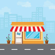 Shop in the front style is located along the road amidst the vast capital city.