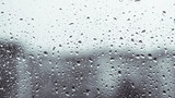 Fototapeta Tęcza - Rainy window. raindrops on a window glass at night. dark blue wet, drops of water rain on glass background. concept of autumn weather.