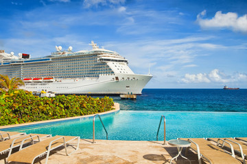 Wall Mural - View from pool at tropical resort on cruise ship docked at port 