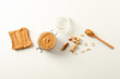 © Atlas - Flat lay composition with peanut butter sandwich, glass jar, peanut and spoon on white background, space for text