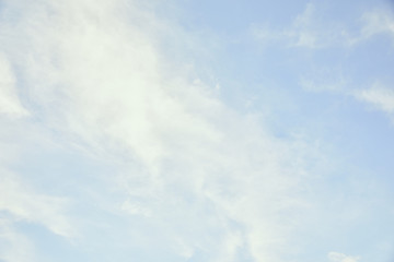peaceful light blue sky with white clouds and copy space