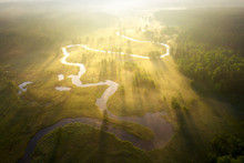 Misty Morning River In Sunlight. River Landscape Aerial View. Riverside View From Above. Summer Nature In Sun Rays. Drone View On  Sunny Nature. Scenery River Top View.