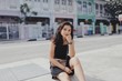 © Yun Heng Lin/Scopio - woman sitting on pavement