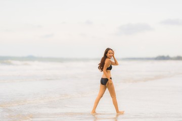 Portrait beautiful young asian woman wear bikini on the beach sea ocean