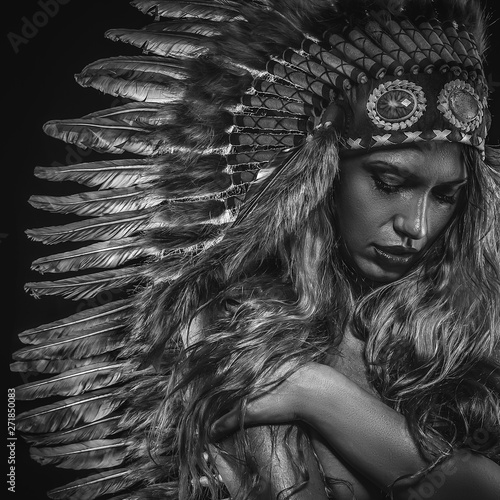 Plakat Shaman beautiful girl with plume of american indian feathers