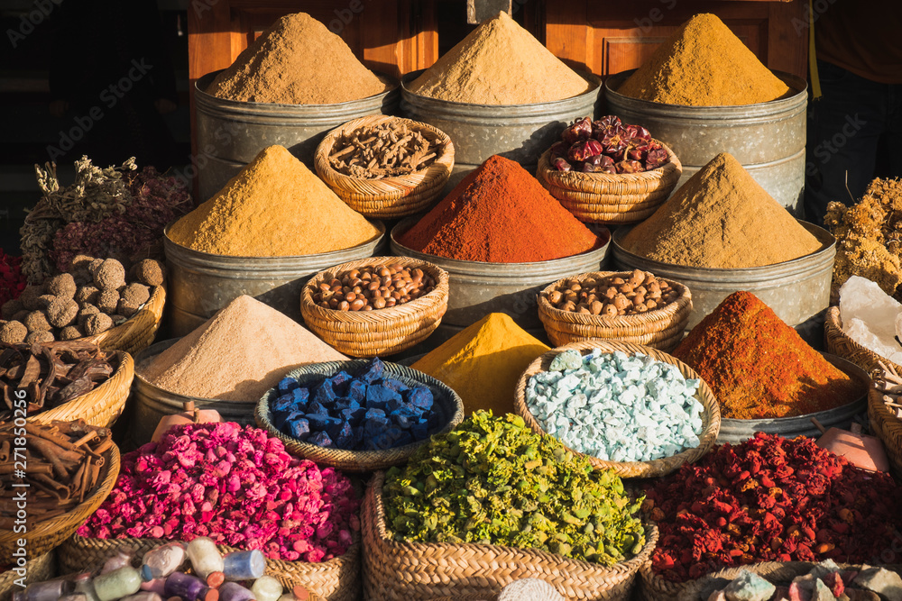 Colorful spices at a traditional market in Marrakech, Morocco - obrazy, fototapety, plakaty 