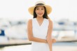 © siraphol - Portrait beautiful young asian woman leisure smile happy relax around yacht port