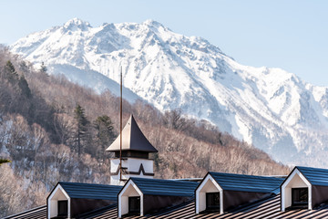 Wall Mural - Takayama, Japan Mountain with snow in Shinhotaka Ropeway cable car view in Gifu Prefecture park on spring with architecture building