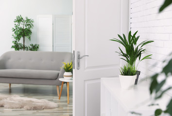 Poster - Living room interior with stylish furniture and open door