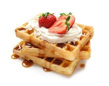 Yummy Waffles With Whipped Cream, Strawberries And Caramel Syrup On White Background