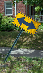 Leaning neighborhood right and left turn sign.