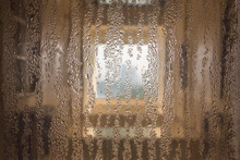 Wet Weather, The Light-transparent Glass Is Covered With Irregular Water Droplets.