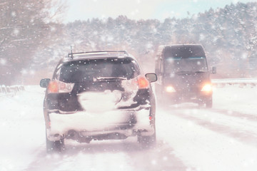 Wall Mural - Driving in snow storm on bad winter Road