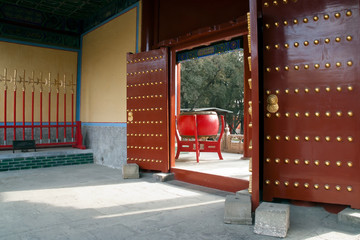 Beijing China, looking through the open entrance to large red drum at the Temple of Confucius 