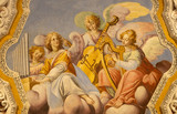 OSSUCCIO, ITALY - MAY 8, 2015: The baroque fresco choir of angels with the music instruments in church Sacro Monte della Beata Vergine del Soccorso by Salvatore Pozzi di Puria  (1595 â€“ 1681).