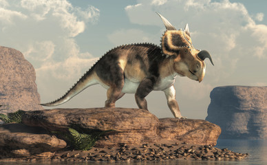 Aufkleber - An Einiosaurus on boulders by a lake in an arid region. Einiosaurus was a ceratopsian dinosaur, like the triceratops, from the Cretaceous period. 3D Rendering