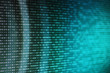 © suebsiri - Binary code computer theme background. selective focus image of led display showing computer language matrix. out of focus circular light in the back.