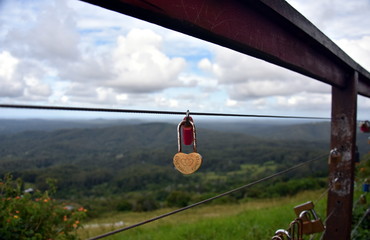 Couples showing their everlasting love (Love you forever) by attaching a coloured padlock to the Gerrards lookout iron fence of the  as a token of love.