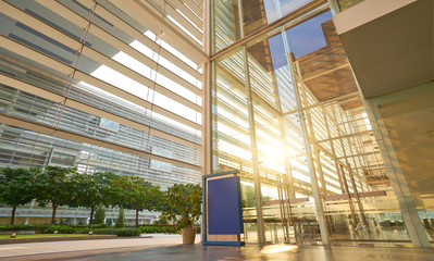 Modern glass facade business office building exterior with floor ,evening scene .