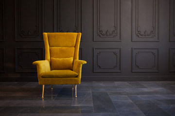 Stylish bright yellow chair against a dark gray wall